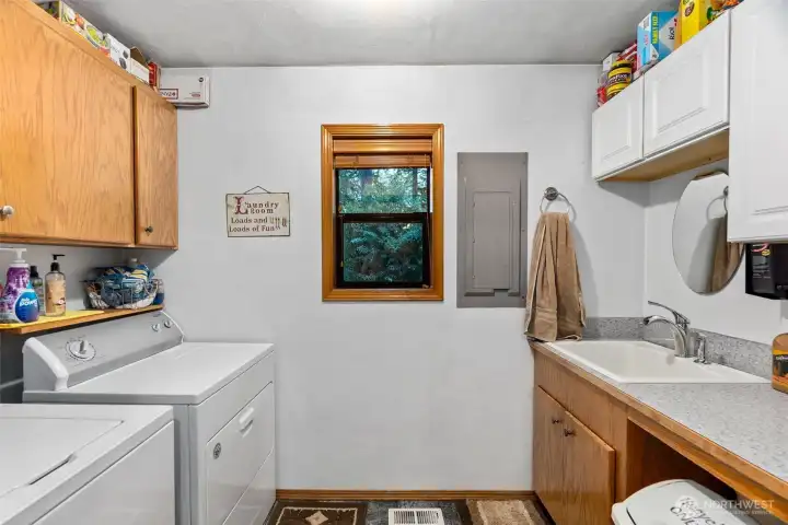 Good size laundry room with utility sink