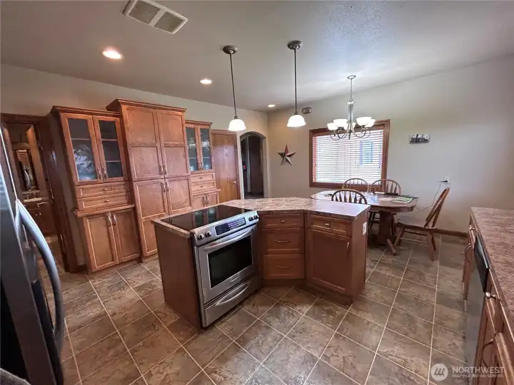 Stainless steel appliances and a pantry with pull out shelving. Self closing cupboards and drawers