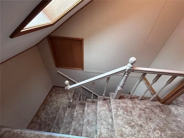 Upper floor stairwell with skylight