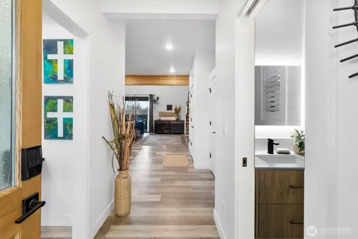 Entry with guest bath on right, office on left