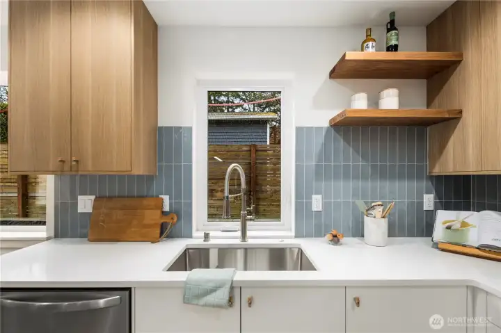 Extra deep single stainless undermount sink and re-claimed wood shelving