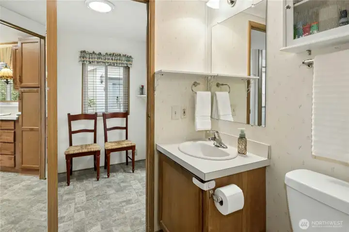 2nd bathroom has a tub/shower to the left and works as a pass-thru from laundry room to bedrooms