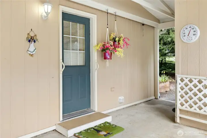 Back door in carport...this home has a unique rolling gate, so you can let the dog out from the back door