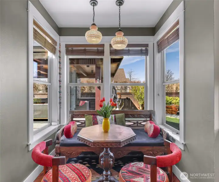 Breakfast nook overlooking the beautiful backyard and outdoor living