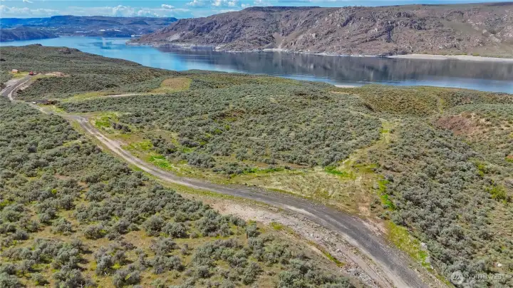 Lot 2 46040 Arrowleaf Canyon Dr N has 5.02 acres with open Lake Roosevelt views and surrounding mountain views