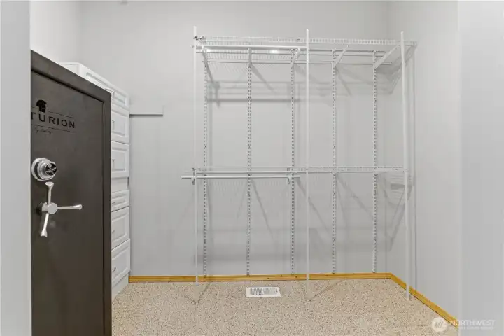 Primary walk in closet with large safe.