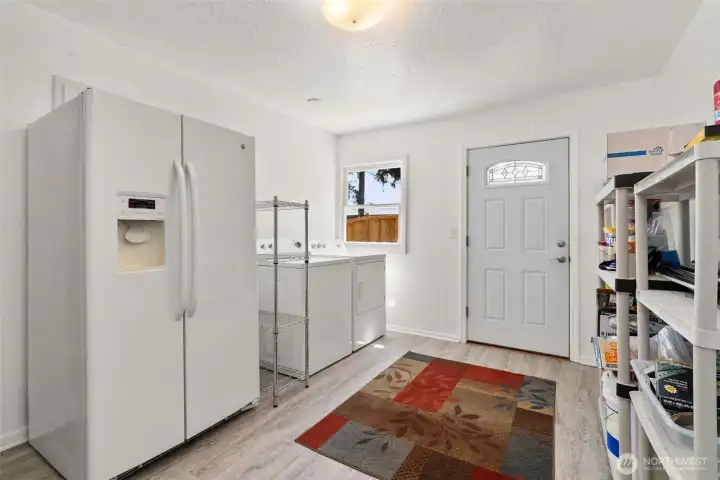 Spacious Laundry room with entrance to exterior home.
