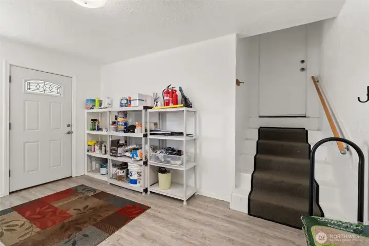 Laundry room with entrance to garage.