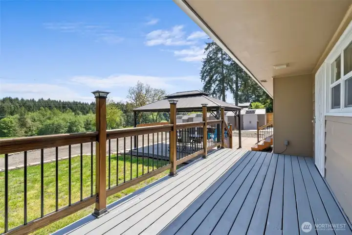 Partially covered deck with territorial view.