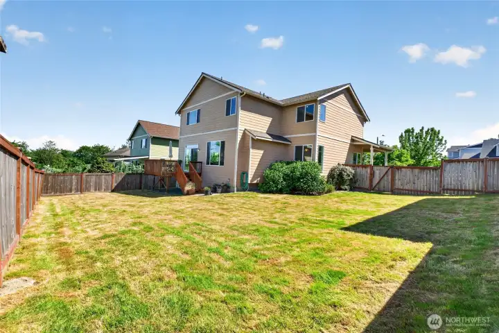The back yard is large and fully fenced. Plenty of room to play! The back yard is large and fully fenced. Plenty of room to play!