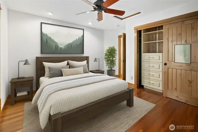The 2nd upstairs bedroom features custom built-in closets, offering both functionality and style. Along with your own private deck to enjoy your morning coffee in the fresh mountain air.