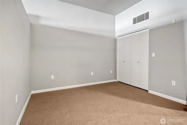 Dual doors conceal the walk-in closet.