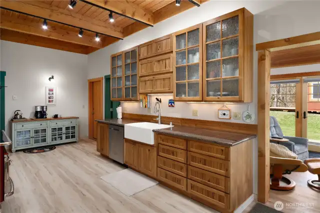 Kitchen boasts "Rainforest" wave glass, farm sink, and custom Hickory cabinets made in Arlington, WA.