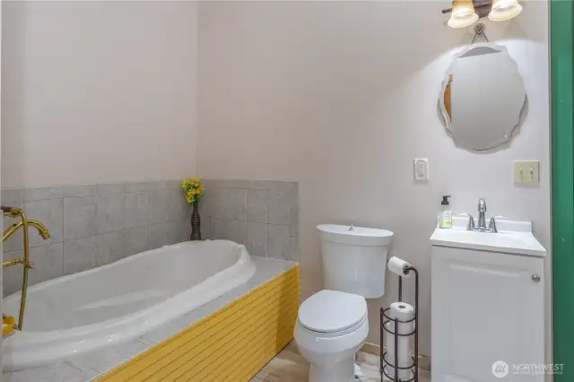 Lower level  full bath doubles as the laundry room.