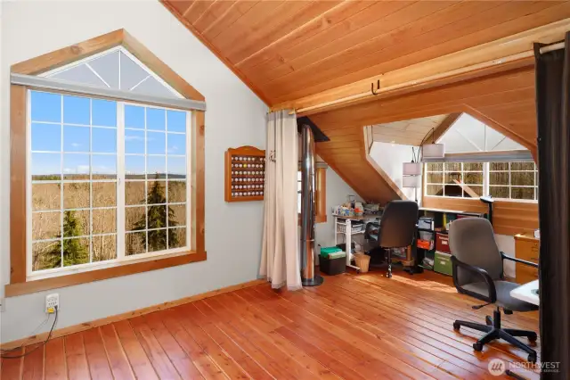 The beautiful upper level has wonderful views, gorgeous real wood floors, cedar trim window & delightful spaces.