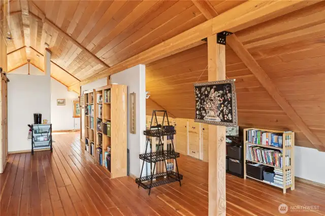 Stunning custom built home with local Douglas fir. Along the lower walls are several built-in storage cabinets.