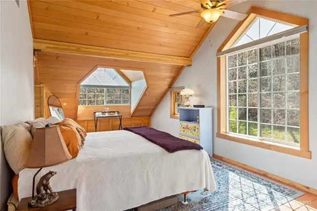 Beautiful upper level second primary bedroom with cedar trim, 100-year-old Douglas Fir ceilings, stunning.