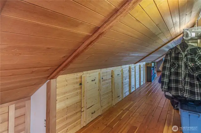 Note the numerous storage spaces along the loft walls. The cedar ceilings came from logs in Matlock, WA.