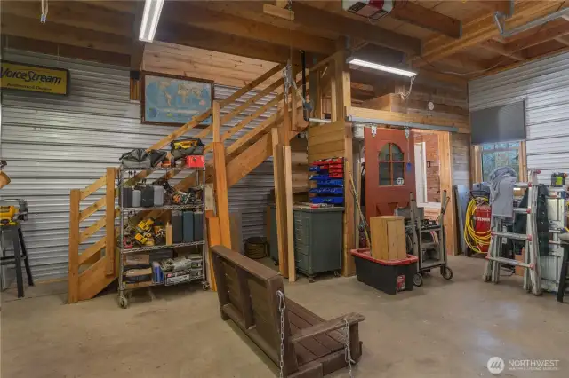 The fabulous garage/shop has lots of lights, a 3/4 bath, washer, dryer & the stairs lead to a loft w/running water.