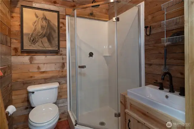 The shop/garage has a 3/4 bath plus a washing machine and dryer, and of course, a hot water tank.
