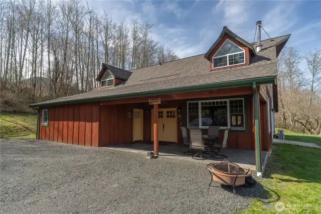 The front entry welcomes you with a covered porch, hanging swing chair, French main door, plus entry to the primary ensuite.