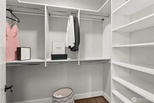 Stay effortlessly organized in the walk-in closet, thoughtfully designed with custom shelving to ensure everything has a place.