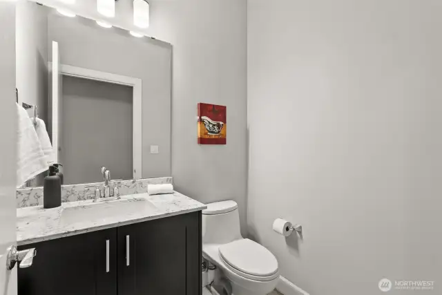 Half bath, featuring modern fixtures and a clean design to ensure comfort for your guests.