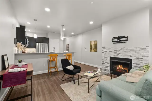 Spacious enough to accommodate a dining table, with additional seating available at the bar top—perfect for entertaining or casual meals