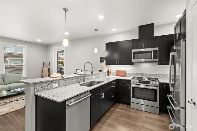 Gourmet kitchen with quartz countertops, Bosch appliances, and soft-close cabinetry.