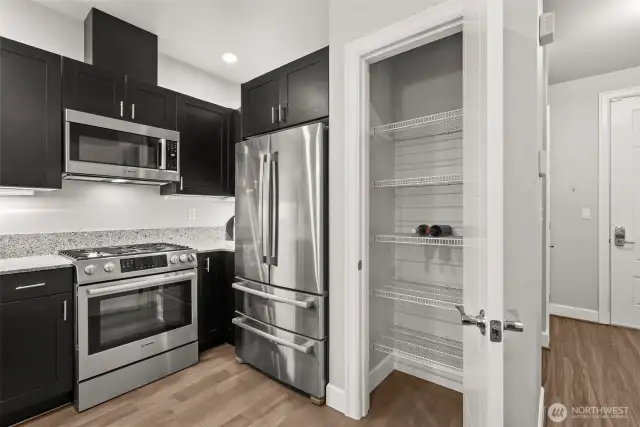 Generous sized pantry offers extra storage. "Pizza-sized" refrigerator is like-new.