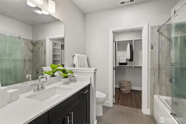 En-suite featuring spa-inspired finishes and spacious walk-in closet for ultimate comfort and convenience.