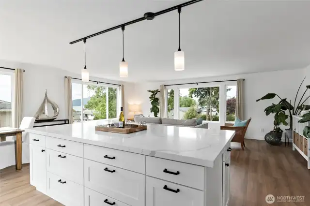 Enjoy a brand-new, oversized island with ample seating—perfect for gathering and entertaining. Featuring stunning quartz countertops and an abundance of storage, this kitchen combines style, function, and convenience.