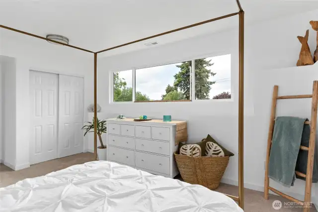 An exceptional bedroom featuring views of the sound and abundant natural light. This beautifully remodeled space boasts all-new flooring, fresh paint, updated windows—creating a comfortable and inviting retreat.