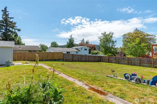 The fenced backyard includes a spacious patio area and plenty of room to bring your outdoor dreams to life—perfect for entertaining, gardening, or simply relaxing in privacy.