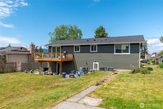 The exterior boasts brand-new Hardie Plank siding, fresh paint, a new roof, an inviting deck, and windows throughout—combining durability with curb appeal.