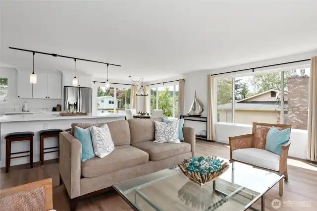 With its open floor plan and large windows, this home is designed for connection and comfort. Whether you're cooking in the kitchen or relaxing in the living area, you'll never miss a moment of the conversation or the view.