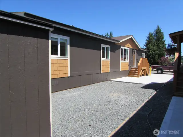 CARPORT WILL BE BUILT ON CONCRETE DRIVEWAY WITHIN 90 DAYS OF NEW OWNERS MOVING IN.