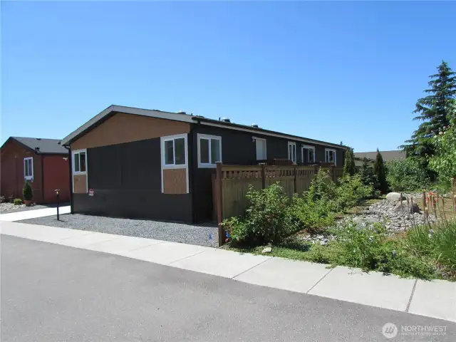 HOME IS NEXT TO PARK ENTRY, W/ LARGE LANDSCAPED BUFFER W/ 6 FT FENCE.