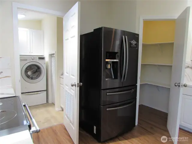 LOTS OF STORAGE IN BOTH KITCHEN AND UTILITY ROOM.