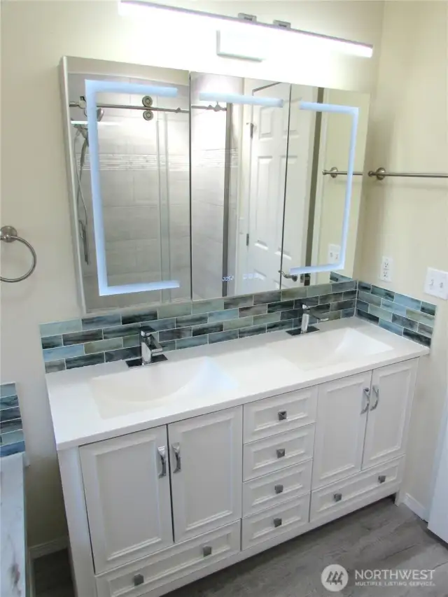 DOUBLE SINK W/ NICE ADDED FEATURES TO PAMPER YOU WITH.