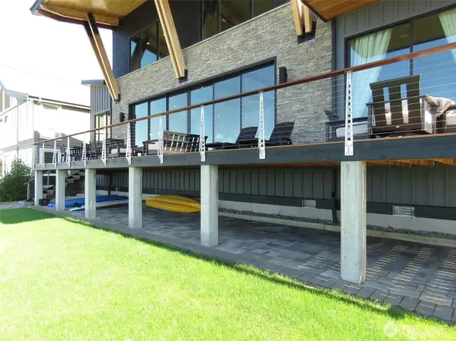 Deck w/custom stainless steel architectural posts and finished paver storage below
