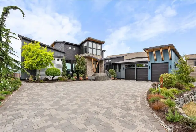 Grand custom paver driveway leading to spectacular entry