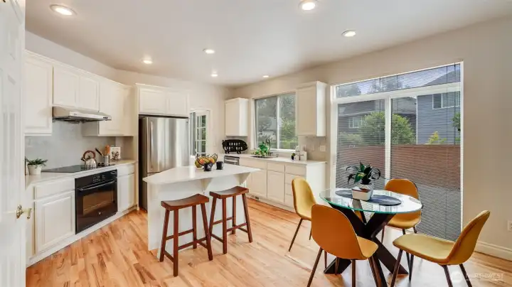 This kitchen offers an informal eating space with direct access to the entertainment sized patio for easy indoor/outdoor living.