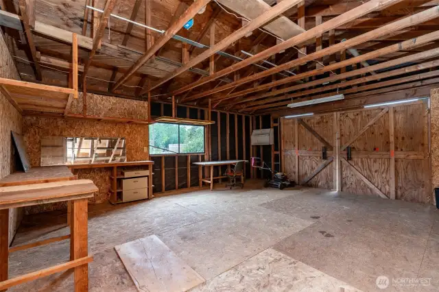 560+- Sq Ft shop with alley access. Could be a garage by removing wood flooring