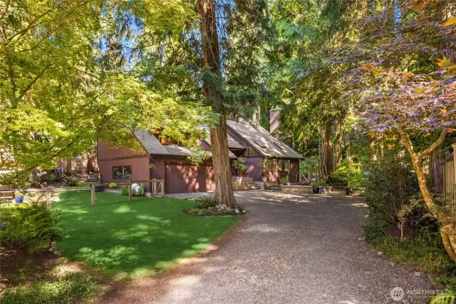 Welcome to this magical woodland retreat nestled in a tranquil, fenced 0.32-acre setting surrounded by nature