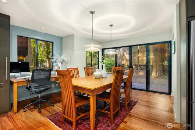 Adjacent to the kitchen is the dining room with office nook and access to a deck and the back yard. There's also a convenient powder room (not shown).