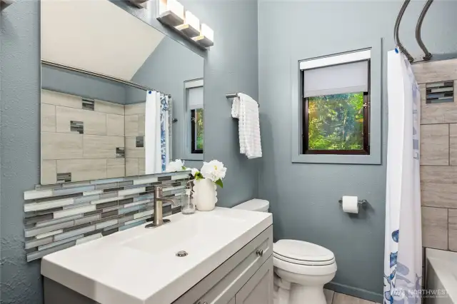 An updated full bathroom complements the secondary bedroom wing