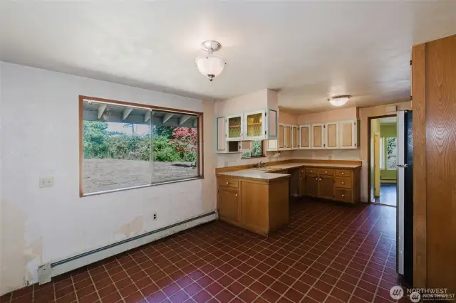 Another look at Kitchen showing storage open to dining area.