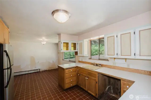 looking into dining area from kitchen. Lovely flow in this home.