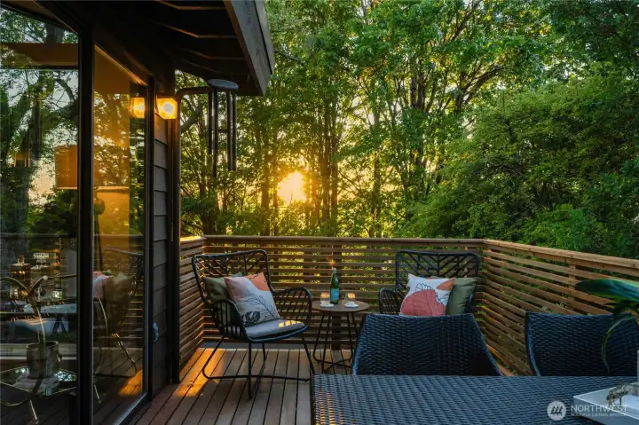 Seamless indoor–outdoor connection, where glass doors open to a woodland-wrapped lanai offering privacy, greenery, and effortless flow for entertaining or retreat.”